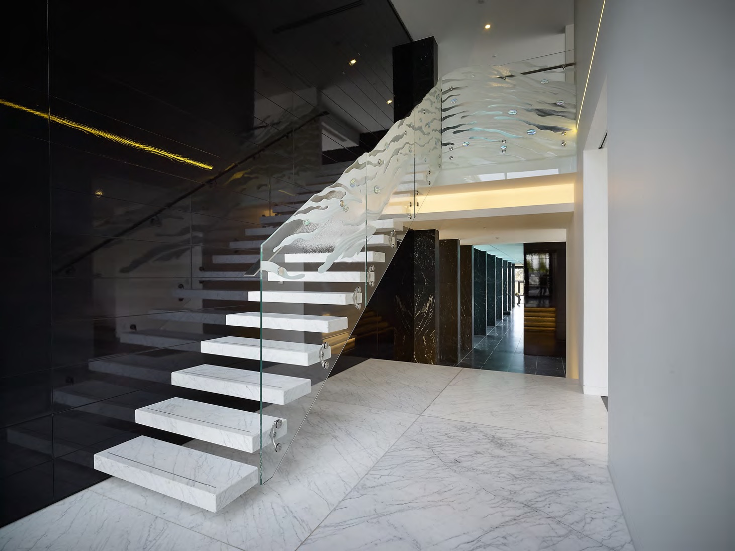 glass stairs with automated lighting and heating home