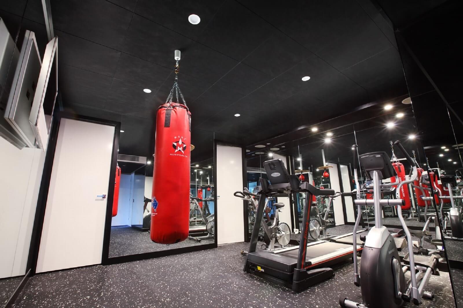 The Toorak home auomation meant the home gym with a red punching back hanging in the centre of the room was climate controlled. Treadmill and bikes sit in the background
